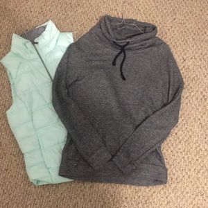 Light blue vest and grey cowl neck sweatshirt